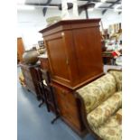 AN EDWARDIAN MAHOGANY SIDE CABINET WITH BRUSHING SLIDE.