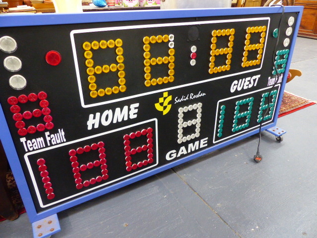 A VINTAGE ILLUMINATING SCOREBOARD.