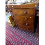 AN EARLY 19th.C.MAHOGANY BOW FRONT CHEST OF FOUR GRADUATED DRAWERS.