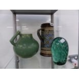 A LARGE DOULTON JUG AND A CLARICE CLIFF GREEN GLAZE JUG TOGETHER WITH A VICTORIAN GREEN GLASS