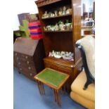 A YEW WOOD BOOKCASE CABINET AND A NEST OF TABLES.