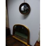 A GILT FRAMED OVERMANTLE MIRROR AND A CONVEX MIRROR.