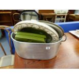 A LARGE ALUMINIUM COOKING PAN, A MIRROR AND BATHROOM SCALES.