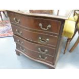 A SERPENTINE FRONT MAHOGANY CHEST OF DRAWERS.