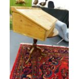 A GEORGIAN TILT TOP TABLE AND A PINE CLERK'S DESK.