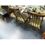 AN ERCOL DINING TABLE AND SIX CHAIRS.