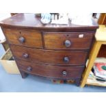 AN EARLY VICTORIAN MAHOGANY BOW FRONT CHEST OF DRAWERS.