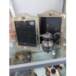 A PAIR OF PLATED FRAMES AND A HOT WATER JUG.