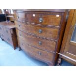 A GEORGIAN MAHOGANY BOW FRONT CHEST OF DRAWERS.