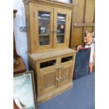 A VICTORIAN PINE GLAZED TOP DRESSER.