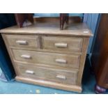 AN EDWARDIAN PINE CHEST OF DRAWERS.