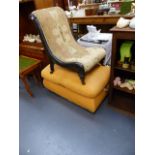 A VICTORIAN EBONISED NURSING CHAIR AND A BOX OTTOMAN.