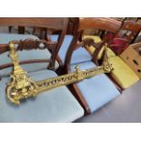 AN ANTIQUE BRASS FIRE FRONT.