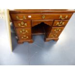 A GEORGIAN MAHOGANY KNEEHOLE WRITING DESK.