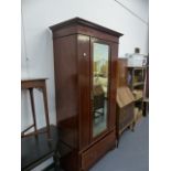 AN EDWARDIAN MAHOGANY AND INLAID SINGLE DOOR WARDROBE.