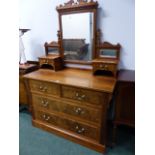 AN EDWARDIAN WALNUT DRESSING CHEST AND A WALNUT BEDSIDE CABINET.