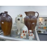 FOUR STAFFORDSHIRE SPANIELS, A STONEWARE JUG AND A FLAGON.