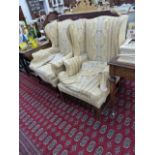 TWO GEORGIAN STYLE WING BACK ARMCHAIRS.