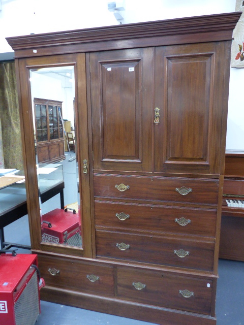 A LARGE EDWARDIAN MAHOGANY COMPACTUM WARDROBE BY SHULBRED & CO.