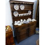 A SMALL OAK DRESSER.