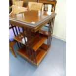 AN EDWARDIAN MAHOGANY REVOLVING BOOKCASE.