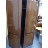 A MAHOGANY BOW FRONT TWO DOOR WARDROBE.