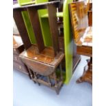 A CARVED OAK GATELEG TABLE AND TWO SHELVES.