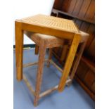 AN ART DECO TABLE AND A STOOL.