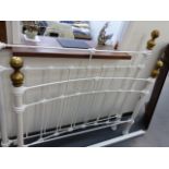 A BRASS AND IRON DOUBLE BED.