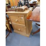 A PINE FILING CABINET.