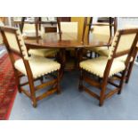 A GOOD QUALITY BESPOKE OAK EXTENDING DINING TABLE WITH SIX MATCHING CHAIRS.