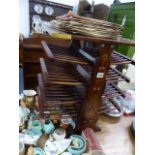 AN EASTERN HARDWOOD AND BRASS INLAID BOOKSTAND.