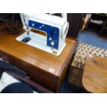 A CABINET SEWING MACHINE.