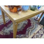 AN OAK DRAW LEAF TABLE.