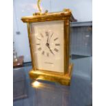 A BRASS CASED CARRIAGE CLOCK, DIAL SIGNED JEAN RENNETT.