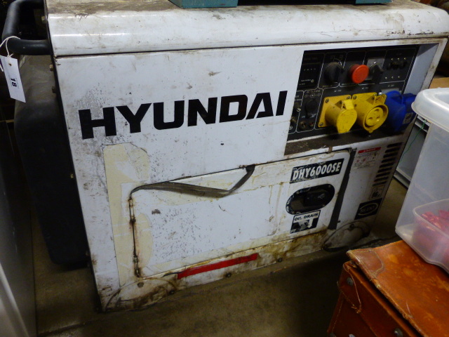 A HYUNDAI DIESEL GENERATOR WITH INSTRUCTION MANUAL.