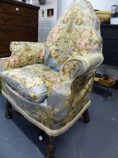 A QUEEN ANNE STYLE ARMCHAIR.