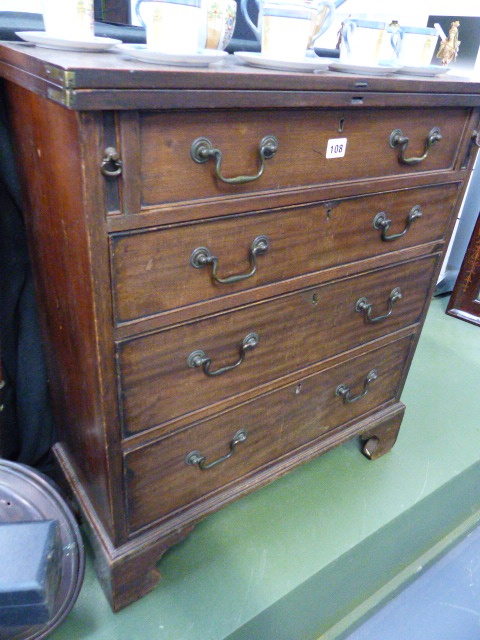 A GEORGIAN STYLE BATCHELOR'S CHEST.