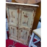 A PAINTED PINE SMALL CUPBOARD.