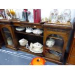 A REGENCY ROSEWOOD INVERTED BREAKFRONT BOOKCASE.