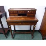 A BRASS MOUNTED ROSEWOOD AND INLAID LADIES WRITING TABLE.