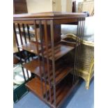 AN EDWARDIAN MAHOGANY REVOLVING BOOKCASE.