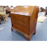 A GEO.III.MAHOGANY BUREAU ON OGEE BRACKET FEET.