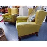 AN UNUSUAL PAIR OF ART DECO WING ARMCHAIRS ON CLAW AND BALL FEET.