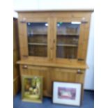 A LARGE PINE GLAZED DRESSER.