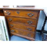 A GEORGIAN STYLE SMALL FOUR DRAWER CHEST.