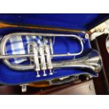 A SILVER PLATED WIND INSTRUMENT.