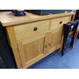 A LOW OAK SIDE CABINET.