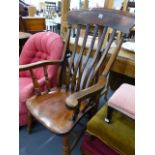 A VICTORIAN SLAT BACK KITCHEN ARMCHAIR.