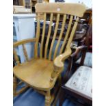 A SLAT BACK ROCKING CHAIR.